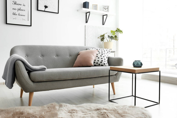 Cozy living room interior with comfortable sofa - Фото, зображення