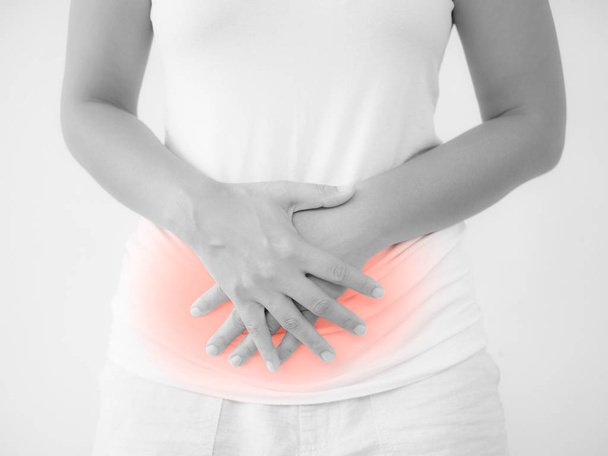 Mulher com dor de estômago ou menstruação
  - Foto, Imagem
