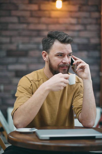 young handsome bearded man in cafe  - Foto, Imagen