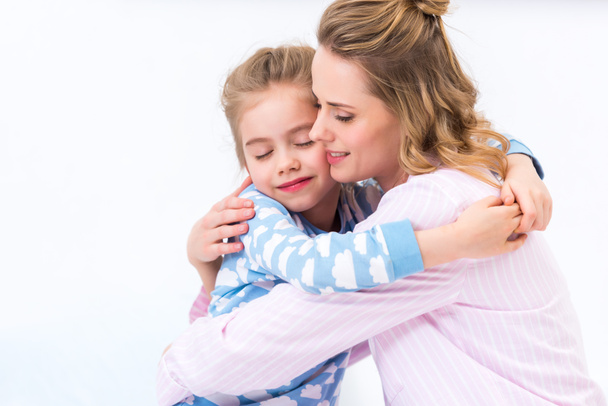tender mother and daughter hugging at home - Foto, Bild