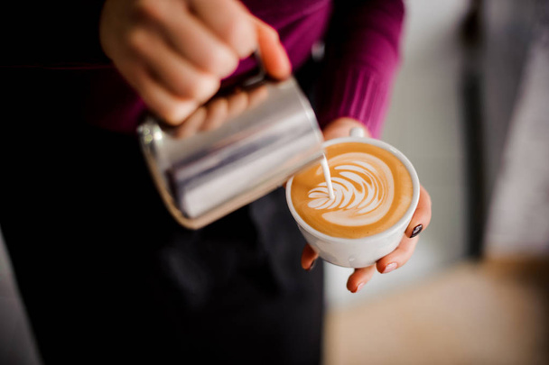 Barista making a milk art in the cup of espresso - Foto, Imagen