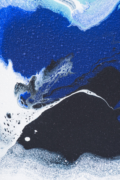 Abstract background with white, black and blue oil paint - 写真・画像