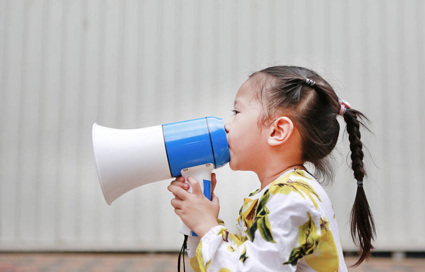 Asian little girl announce by megaphone. Communication concept. - Photo, Image