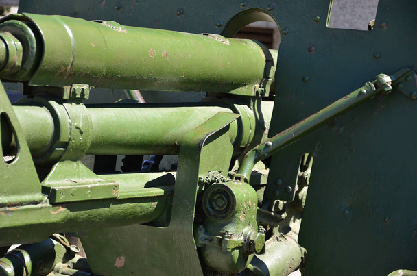 A close-up mechanism of a portable weapon of the Soviet Union of World War II, painted in a dark green color - Photo, Image