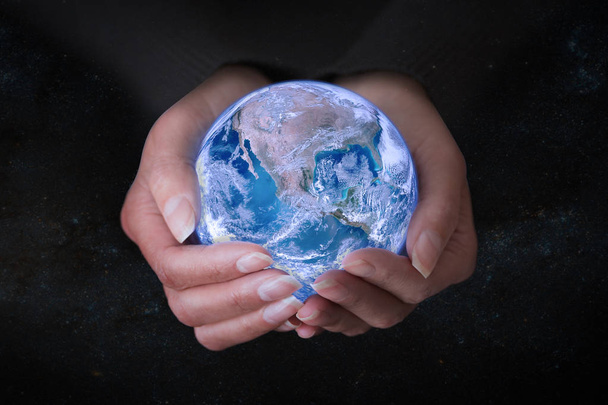 Female hands holding Earth in outer space, concept save the world and nature. - Foto, Bild