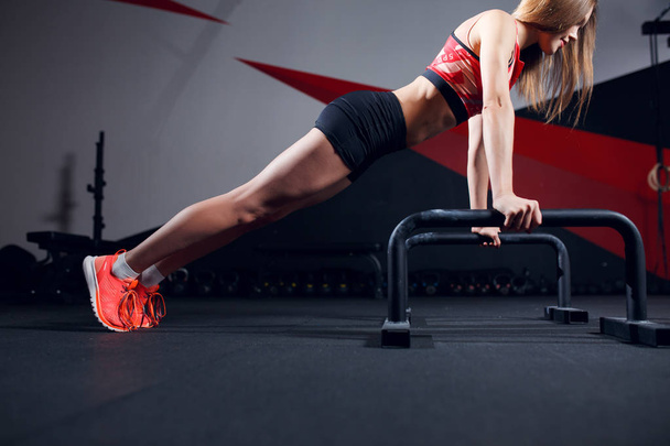 Picture of sports woman doing exercise bar - Photo, Image