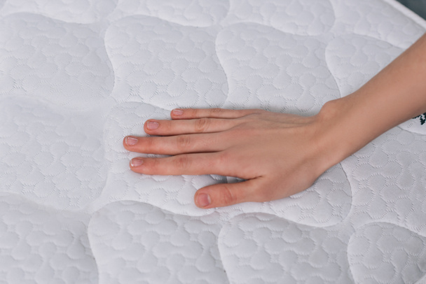 Touching orthopedic mattress - Photo, Image