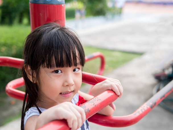 Happy asian baby child playing on playground - 写真・画像