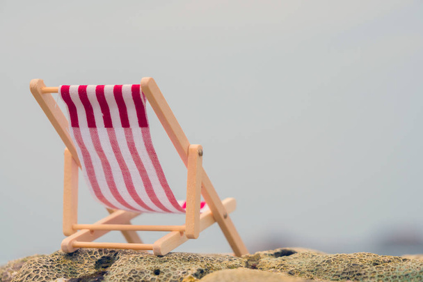 Striped red beach chair. - Фото, зображення