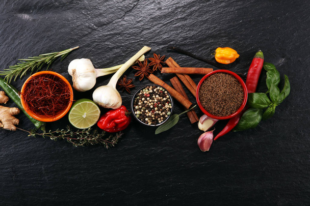 Spices and herbs on table. Food and cuisine ingredients. - Foto, Bild