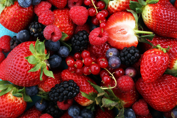 Berries overhead closeup colorful assorted mix of strawberry, bl - Photo, Image