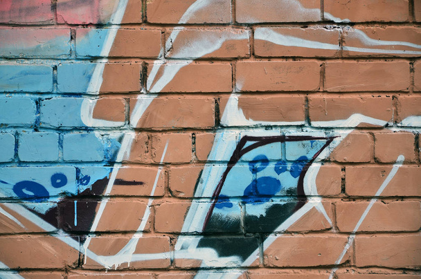 Straatkunst. Kleurrijke graffiti aan de muur. Fragment voor achtergrond. Abstract detail van een graffiti - Foto, afbeelding