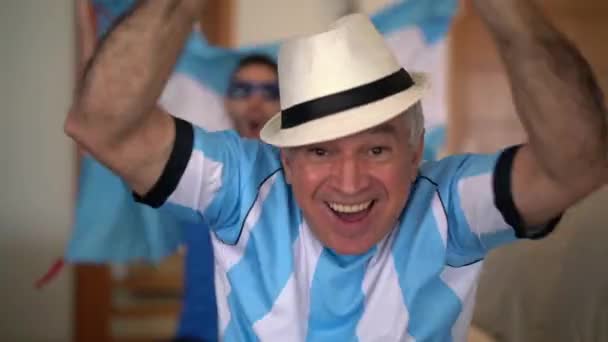 Argentina Father and Son Fans Watching and Celebrating a Soccer Game - Filmati, video
