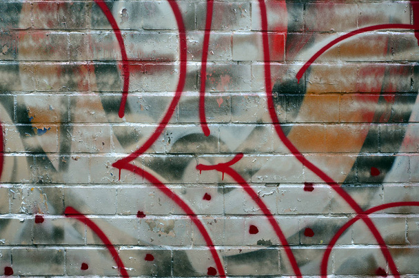 Kunst onder de grond. Beautiful street art graffiti stijl. De muur is versierd met abstracte tekeningen huis verf. Moderne iconische stedelijke cultuur van de straat jeugd. Abstracte stijlvolle afbeelding op de muur - Foto, afbeelding