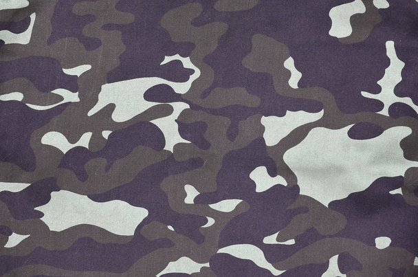 Texture of fabric with a camouflage painted in colors of the marsh. Army background image. Textile pattern of military camouflage fabric - Photo, Image