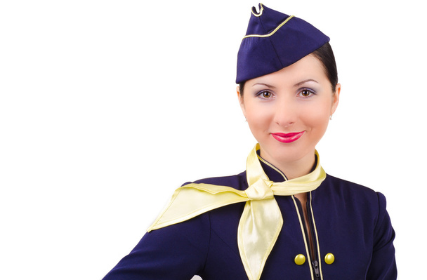 Beautiful young smiling stewardess in uniform isolated - Foto, imagen