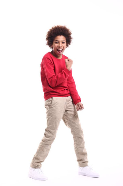 Happy little kid in front of a white background - Photo, image