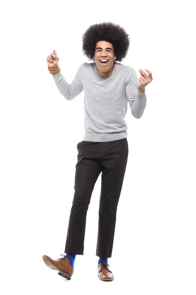 Happy afro man in front of a white background - Foto, imagen