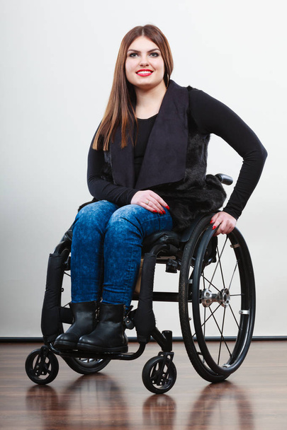 Disabled young girl on wheelchair. - Valokuva, kuva