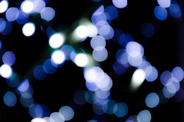 Colored lights, garlands. Blurred photo. Celebratory background. - Photo, Image