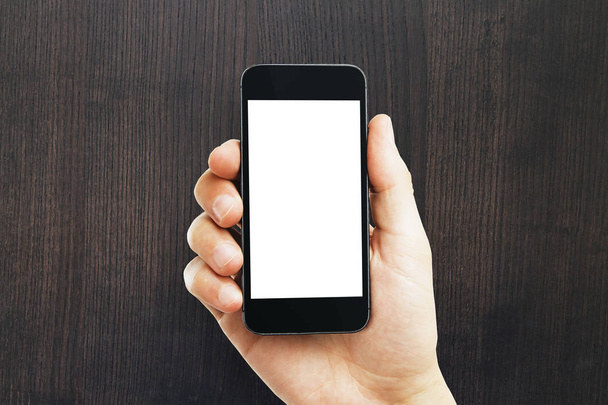 Mão masculina segurando telefone branco vazio
  - Foto, Imagem