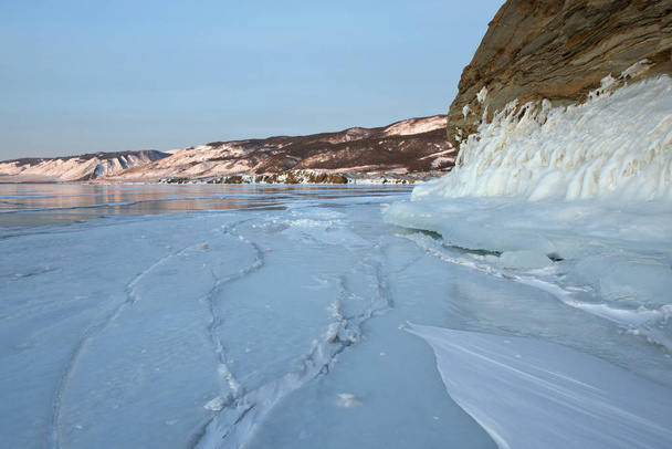 The icy splashes (splash out ice) on the rock, mountains, winter lake Baikal - 写真・画像