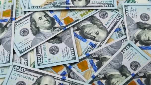 Nuevos dólares estadounidenses rotando como fondo
 - Metraje, vídeo