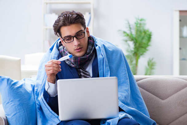 Sick businessman working from home due to flu sickness - Photo, Image