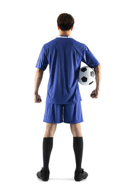 πίσω όψη παίκτης ποδοσφαίρου ποδοσφαίρου νεαρός άνδρας στέκεται - Φωτογραφία, εικόνα