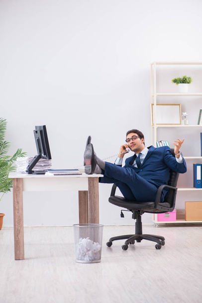 Young handsome businessman employee working in office at desk - Фото, зображення