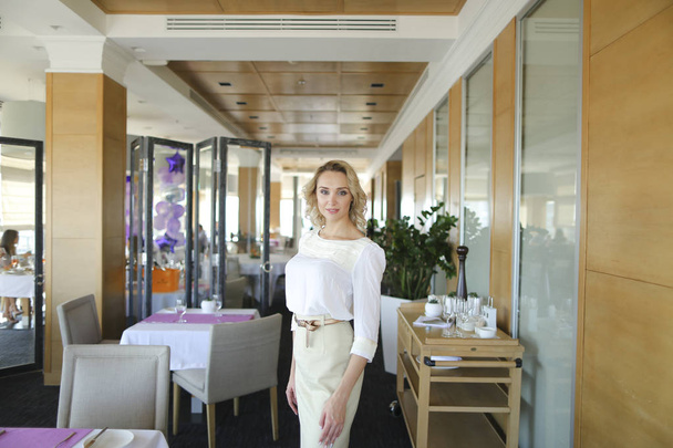 Successful manager standing at restaurant. - 写真・画像