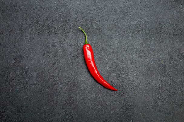 red chili pepper on dark concrete background - Fotografie, Obrázek