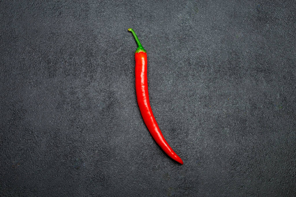 red chili pepper on dark concrete background - Fotoğraf, Görsel