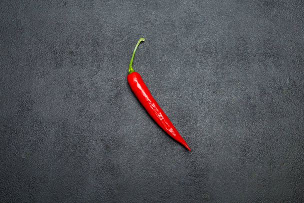 red chili pepper on dark concrete background - Φωτογραφία, εικόνα
