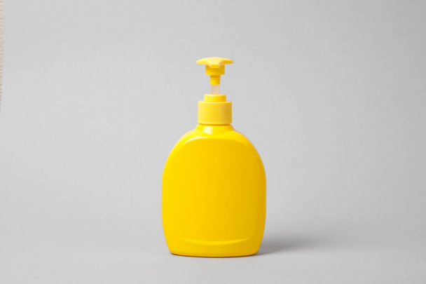 Hygienic cream liquid soap in  yellow plastic bottle.  mockup - Photo, Image