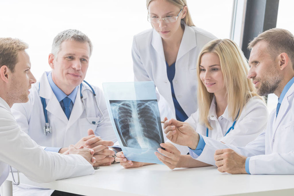 Group of doctors looking at x-ray - Fotó, kép