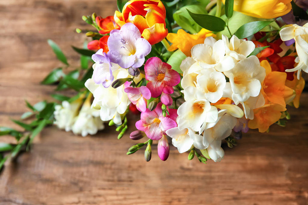 Beautiful bouquet of freesia flowers on table, closeup - Fotoğraf, Görsel
