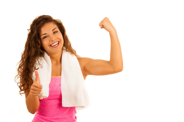 Active young sporty fit woman gesture power with her arms up iso - Photo, image