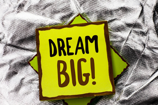 Text sign showing Dream Big. Conceptual photo Motivation Plan Aim Dream Vision Strategy Challenge Idea written on Stacked Sticky Note Paper on the Silver textured background. - Photo, Image
