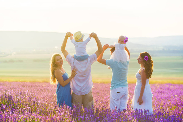 Two friendly family in a lavender field - Фото, изображение