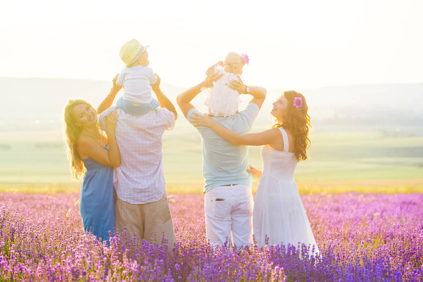 Two friendly family in a lavender field - Fotoğraf, Görsel