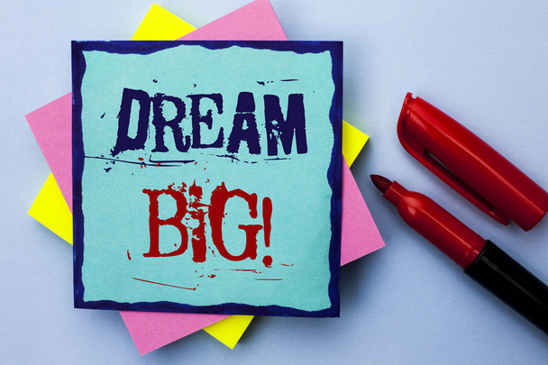 Writing note showing  Dream Big. Business photo showcasing Motivation Plan Aim Dream Vision Strategy Challenge Idea written on Sticky Note Paper on the Plain background Marker next to it. - Photo, Image