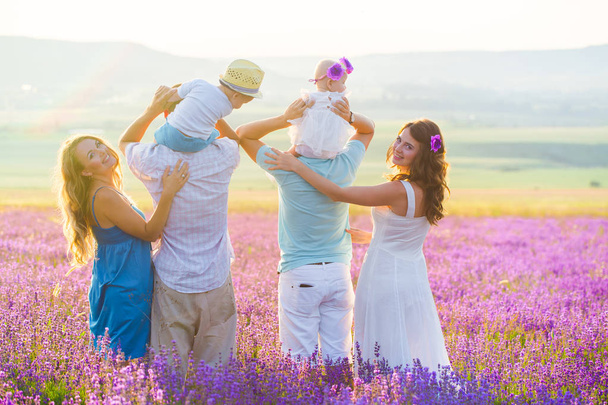 Two friendly family in a lavender field - Foto, imagen