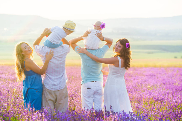 Two friendly family in a lavender field - Valokuva, kuva