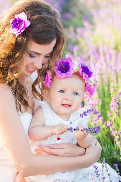 Mom and her daughter in a lavender field - Photo, Image