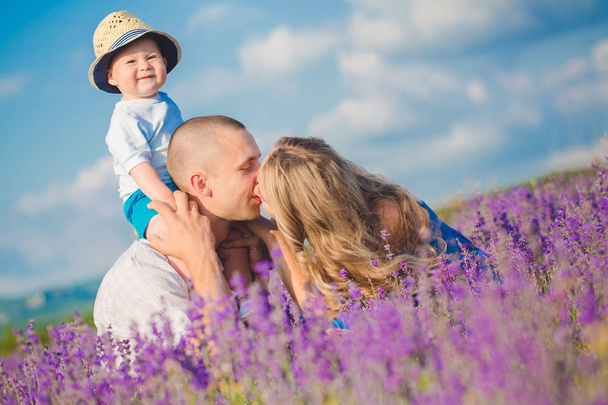 Young family in a lavender field - Fotografie, Obrázek