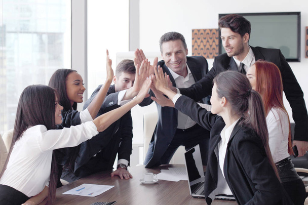 Business team making high five  - Photo, Image