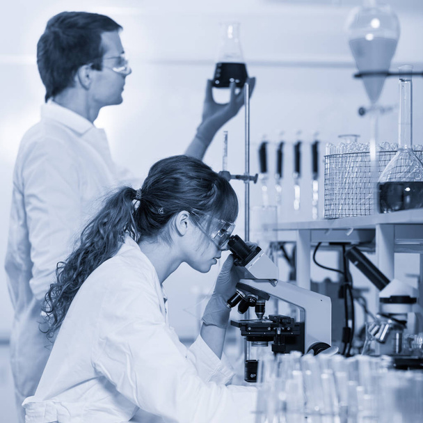 Health care professionals microscoping in scientific laboratory. - Photo, Image