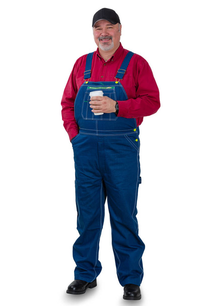 Full length portrait of a worker in dungarees - Foto, imagen