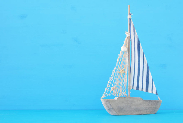 nautical concept with sail boat over blue background. - Φωτογραφία, εικόνα